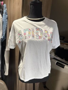 Adidas Graphic White Tee with Colorful Floral Lettering